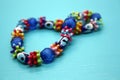 A bracelet made of beads on a blue background Royalty Free Stock Photo