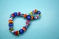 A bracelet made of beads on a blue background Royalty Free Stock Photo