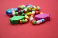 A bracelet made of beads on a red background Royalty Free Stock Photo