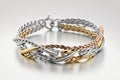 bracelet made of delicate silver and gold chains mixed on white background
