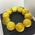 A bracelet made of large balls of white Baltic amber Royalty Free Stock Photo