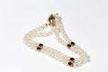 bracelet made of pearls, garnet and diamonds with a gold clasp. Yellow gold and precious stones Royalty Free Stock Photo