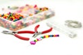 Bracelet made of plastic beads for girls unfinished in process