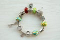 Bracelet with many accessories, luck, money, an owl