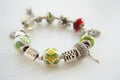 Bracelet with many accessories, luck, money, an owl