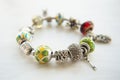 Bracelet with many accessories, luck, money, an owl