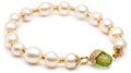 a bracelet with pearls and a green crystal beaded clasp on a white background with a gold clasp and a green crystal beaded clasp