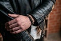 Bracelets made of natural stones and minerals, on a man`s wrist, close-up