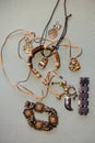 Bracelets, pendants on the neck, earrings in yellow tones Royalty Free Stock Photo
