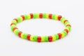 bracelets with plastic beads in red, green and yellow Royalty Free Stock Photo