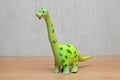 Brachiosaurus dinosaurs toy on wooden table. Royalty Free Stock Photo