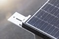 Bracket for mounting solar panels. Mounting a solar panel close-up on the roof of a residential building, water drops after rain,