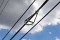 Bracket of a snowshoe bend limiter for fiber optics against a blue sky with clouds Royalty Free Stock Photo