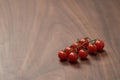 bracnh of fresh cherry tomatoes of wood table Royalty Free Stock Photo