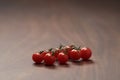 bracnh of fresh cherry tomatoes of wood table Royalty Free Stock Photo