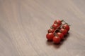 bracnh of fresh cherry tomatoes of wood table Royalty Free Stock Photo