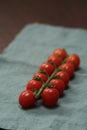 bracnh of fresh cherry tomatoes of wood table Royalty Free Stock Photo