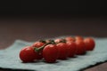bracnh of fresh cherry tomatoes of wood table Royalty Free Stock Photo