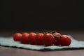 bracnh of fresh cherry tomatoes of wood table Royalty Free Stock Photo