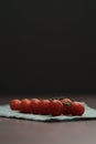 bracnh of fresh cherry tomatoes of wood table Royalty Free Stock Photo