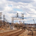 Braddock, Pennsylvania, USA March 19, 2022 Overhead railroad signals above train tracks in an industrial area