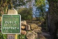 BRADFIELD, UK - 16TH FEBRUARY 2019: A square green public footpath sign in front of a metal gate Royalty Free Stock Photo