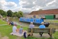 Bradford on Avon, UK - AUGUST 13, 2017: People enjoying a summer day at Canal Wharf with colorful barges on Kennet and Avon Canal