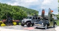 Bradford, Pennsylvania, USA July 5, 2023 A car and a jeep parked outside of the Zippo Case Museum advertising the building