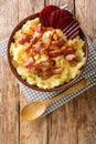 Braendende Kaerlighed or Burning love is an old danish dish with mashed potatoes, crisp bacon bits and soft fried onions close-up Royalty Free Stock Photo