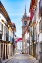 street scene in the old town of Braga with historic facades and people in early morning