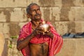 Brahmin man meditating at the holy river Ganges in the morning, Varanasi, Uttar Pradesh, India, Asia