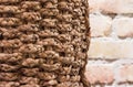 Braid basket with brick wall background interior texture Royalty Free Stock Photo