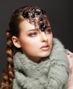 Braided Hair Luxurious Woman in Fur Collar and Gemstones. Jewels Royalty Free Stock Photo