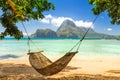 Braided hammock in the shade on a sunny tropical island Royalty Free Stock Photo