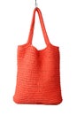 Braided orange bag on a white background