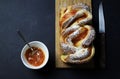 Braided or roll bread. Babka or brioche bread with apricot jam. Royalty Free Stock Photo