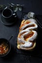 Braided or roll bread. Babka or brioche bread with apricot jam. Royalty Free Stock Photo