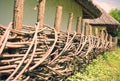 Braided wicker fence near the old house