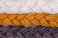 Braided wool yarn samples colored by henna and indigo