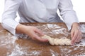 Braiding Challah dough baker on a table flour Royalty Free Stock Photo