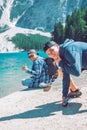 BRAIES, ITALY - June 13, 2019: friends picture at lake beach in mountains