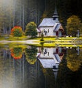 Hut on Braies Lake in Dolomiti mountains and Seeko. Royalty Free Stock Photo