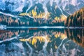 Braies lake with reflection in water at sunrise in autumn Royalty Free Stock Photo