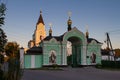 Holy Trinity convent in last evening sun rays on main church dome before sunset, entrance gate open, Brayiliv