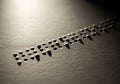 Braille Text Embossed on Textured Surface with Shadowed Dots in Macro Close-Up Royalty Free Stock Photo