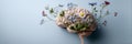 Brain With Flowers Symbolizes Creativity and Growth, Set Against a Calming Blue Background, Inviting Contemplation and Royalty Free Stock Photo
