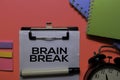 Brain Break write on paperwork. Isolated on pink table background