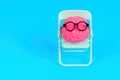 Brain Character Adorned with Glasses Set on a Teal Chair