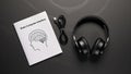 Brain-Computer Interface user manual with headphones on a dark background Royalty Free Stock Photo