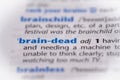 Brain dead word in a dictionary. Selective focus, close up Royalty Free Stock Photo